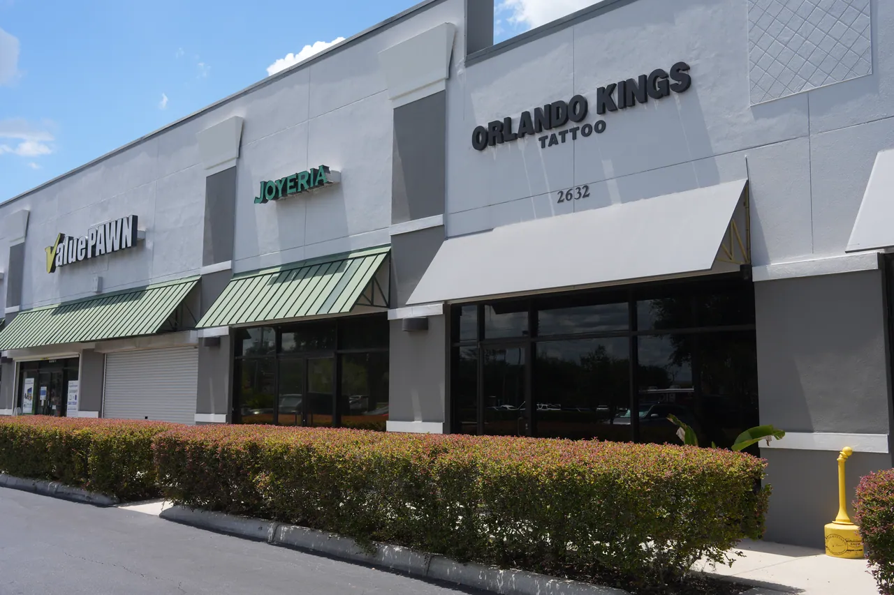 The front of the building with the Orlando Kings Tattoo sign